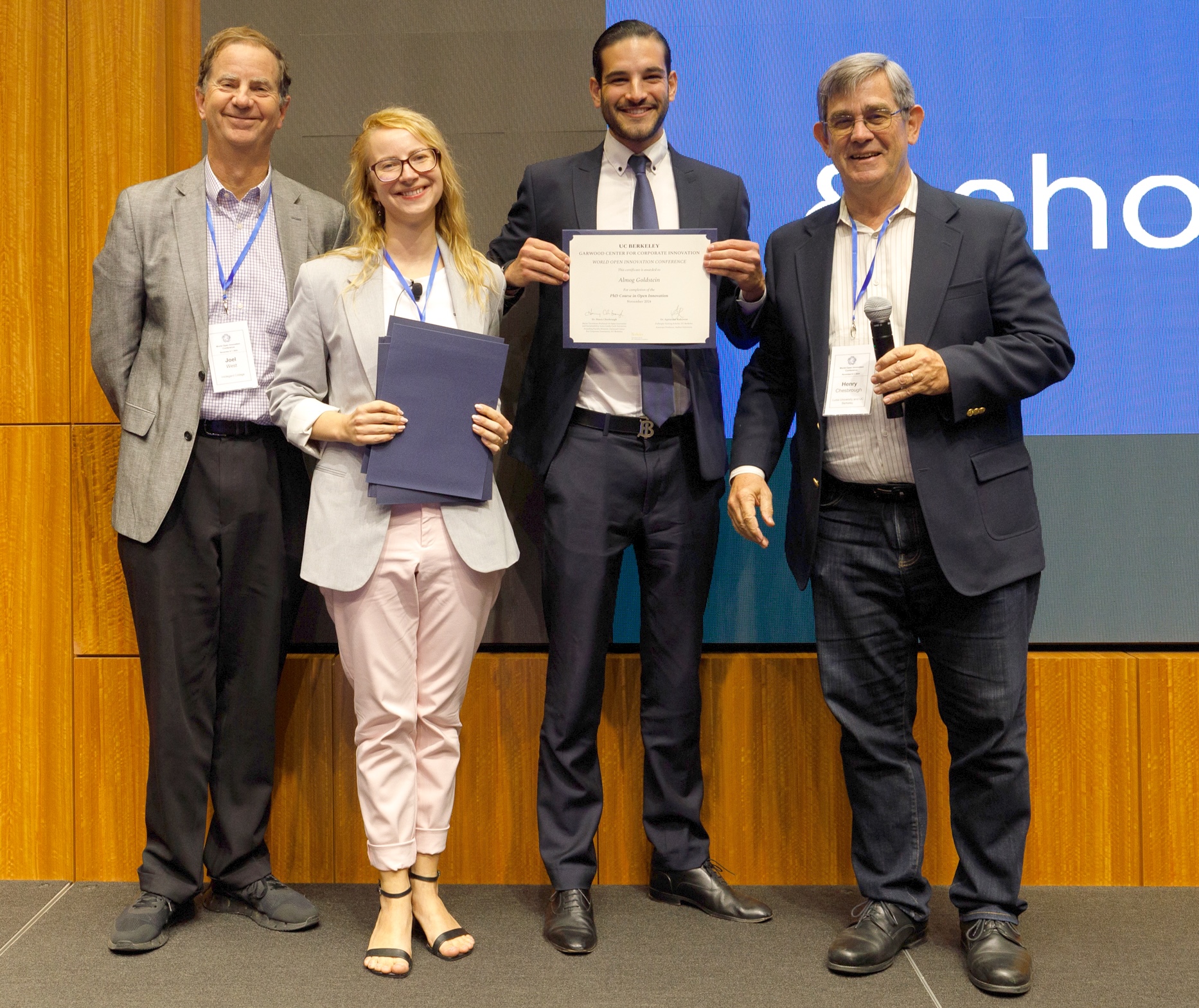 Almog receiving the PhD Course in Open Innovation certificate with Henry Chesbrough and Joel West